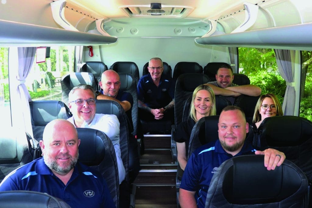 VDI Australia national sales team seated inside a bus, representing state-based coverage and coordinated support.